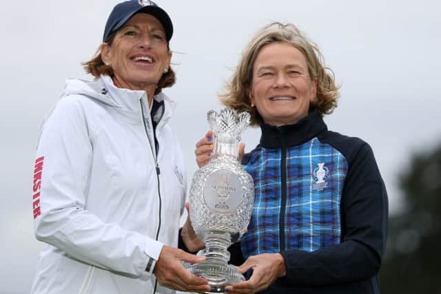 Team captains Juli Inkster, left, and Catriona Matthew pose with the Solheim Cup trophy.