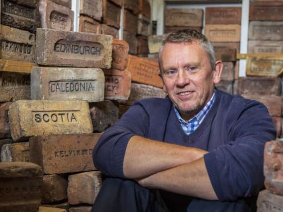 Mark Cranston, 56, has collected over 3,500 bricks since 2010. Picture: Katielee Arrowsmith / SWNS