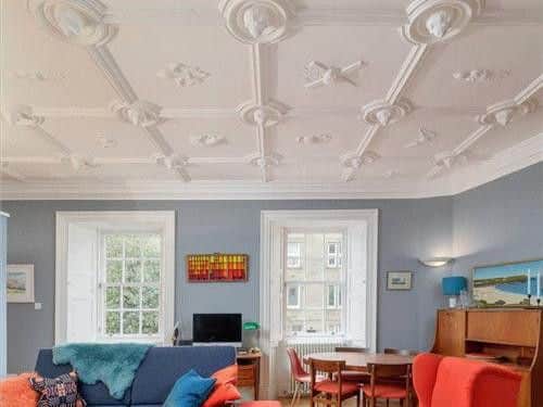 The first floor flat has a magnificent A listed Jacobean strapwork ceiling. The ceiling is dated 1661 and carries the arms of Charles II and the present Queen's arms.