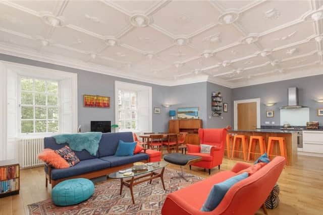 The open plan living room and kitchen.