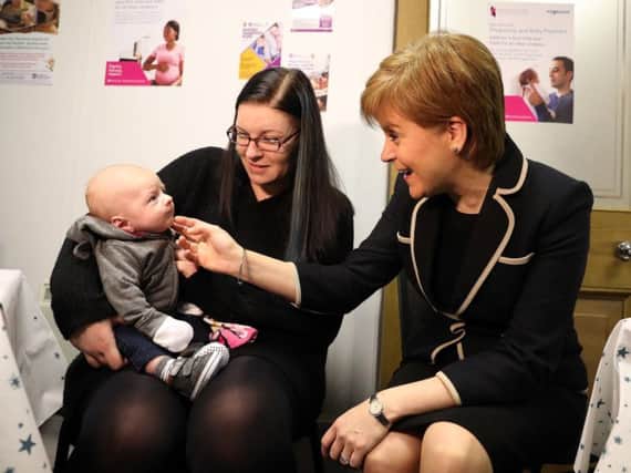 The First Minister met parents helped by the Pregnancy and Baby Payment, for which there has been a large number of claims since it was launched last December. Picture: PA