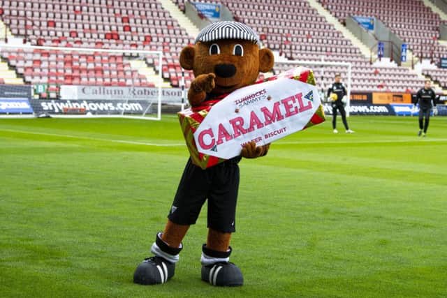 Dunfermline mascot Sammy the Tammy embraces the Tunnock's Caramel Wafer Challenge Cup. Picture: Ross Parker/SNS