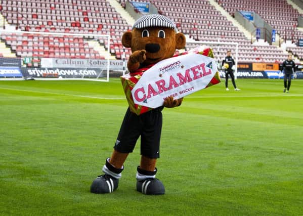 Dunfermline mascot Sammy the Tammy embraces the Tunnock's Caramel Wafer Challenge Cup. Picture: Ross Parker/SNS