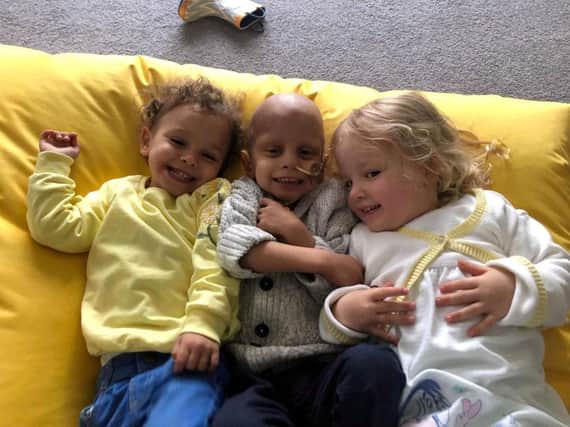 Caleb, who was diagnosed with a rare brain cancer, with sisters Poppy and Alyssia. Picture: SWNS