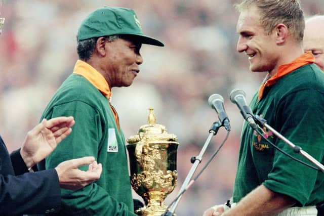 June 1995, South Africa president Nelson Mandela congratulates Springbok skipper François Pienaar after handing him the William Webb Ellis trophy. Picture: Jean-Pierre Muller/AFP/Getty Images