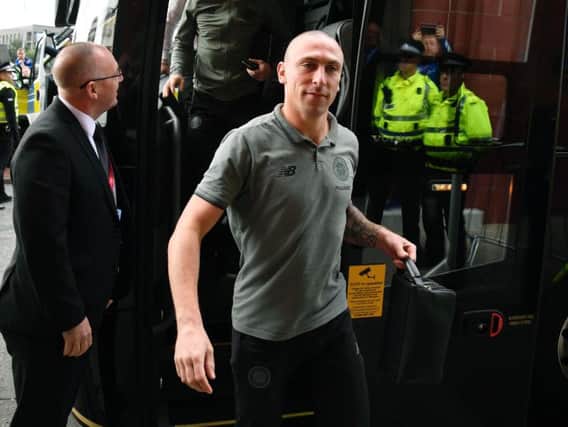 Scott Brown gets off the Celtic team bus at Ibrox ahead of the Old Firm clash with Rangers