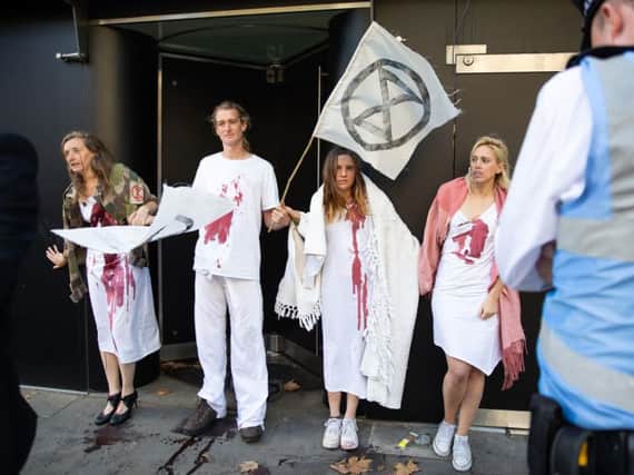 Extinction Rebellion protest during the official opening in The Strand, central London, of London Fashion Week. Picture: PA