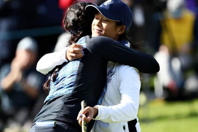 Rookie Celine Boutier, right, is hugged by Georgia Hall after their win in the opening session in the Solheim Cup at Gleneagles. Picture: Getty Images