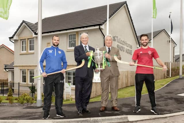 Newtonmores Evan Menzies, left, with George Fraser, of Tulloch Homes, Camanachd Association president Keith Loades and Obans Daniel Cameron.