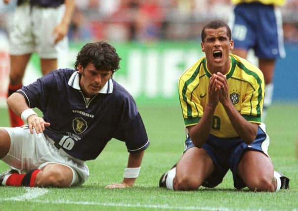 Scotland's Darren Jackson and Rivaldo during the opening game of the 1998 World Cup. Picture: Laurent Rebours/AP