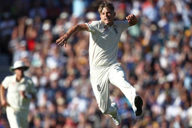 Sam Curran of England celebrates taking the wicket of Tim Paine. Picture: Julian Finney/Getty Images