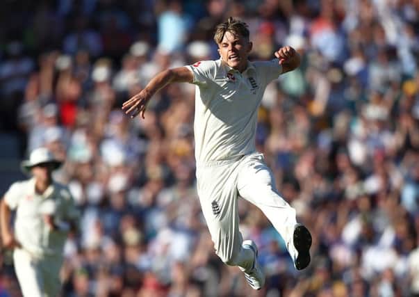 Sam Curran of England celebrates taking the wicket of Tim Paine. Picture: Julian Finney/Getty Images