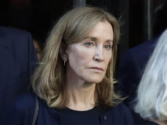Actress Felicity Huffman leaves federal court after her sentencing in a nationwide college admissions bribery scandal. Photo: AP/Elise Amendola