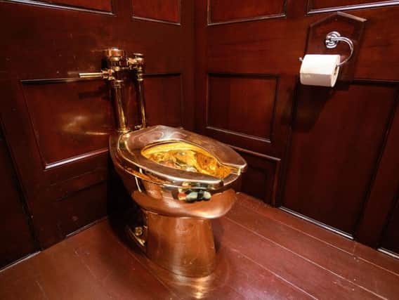 'America', a fully-working solid gold toilet, created by artist Maurizio Cattelan, was on display at Blenheim Palace. Picture: Getty Images