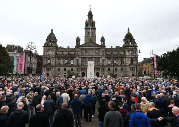 Loyalists gather yesterday in George Square to protest against Glasgow City Council's decision to ban marches this weekend. Picture: John Devlin