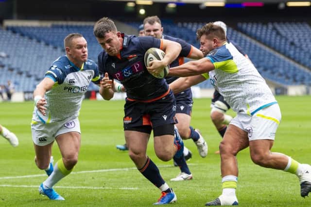 Matt Scott breaks through the Ospreys defence to score. Picture: Ross Parker/SNS