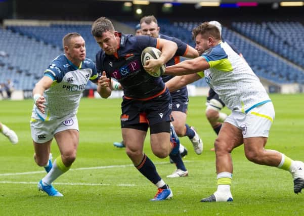 Matt Scott breaks through the Ospreys defence to score. Picture: Ross Parker/SNS