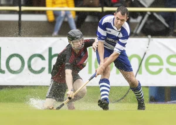 Oban's Daniel Sloss and Newtonmore's Michael Russell at the Tulloch Homes Camanachd Cup Final. Picture: Neil Paterson