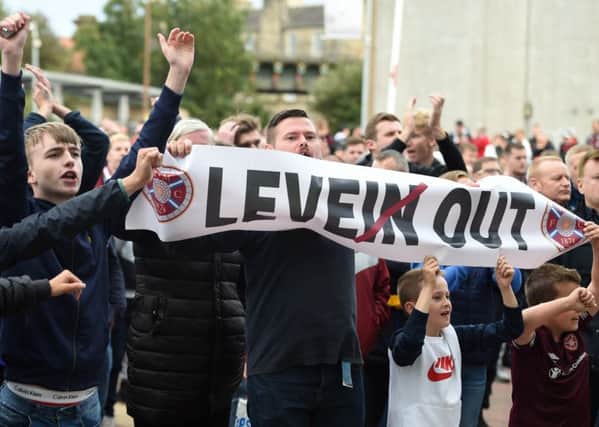Hundreds of Hearts fans gather outside the main stand after Saturdays 3-2 defeat by Motherwell to protest against manager Craig Levein. Picture: SNS.