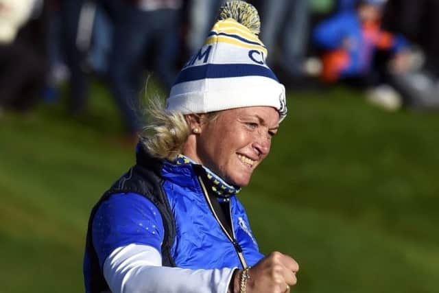 Suzann Pettersen celebrates her putt on the 18th to win the Solheim Cup for Team Europe. Picture: Ian Rutherford
