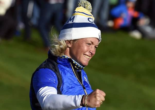 Suzann Pettersen celebrates her putt on the 18th to win the Solheim Cup for Team Europe. Picture: Ian Rutherford