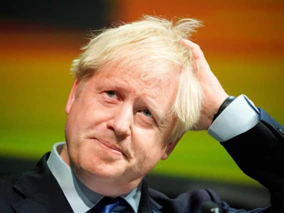Boris Johnson gestures as he delivers his speech at the Convention of the North, in the Magna Centre in Rotherham, norhtern England on September 13. Picture: Getty images