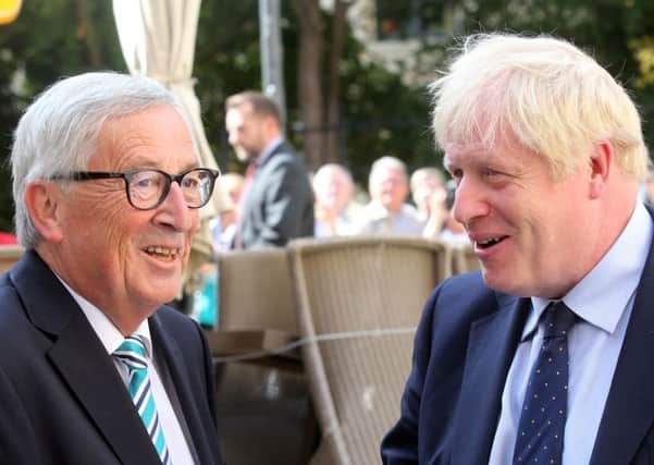 EU Commission president Jean-Claude Juncker welcomes  Boris Johnson prior to their meeting. Picture: Getty