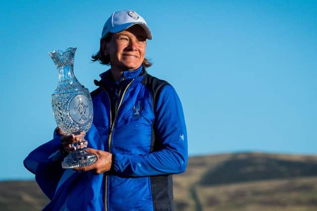 Solheim Cup-winning captain Catriona Matthew poses with the trophy after inspiring her team to their 14½-13½ victory over the USA. Picture: SNS.