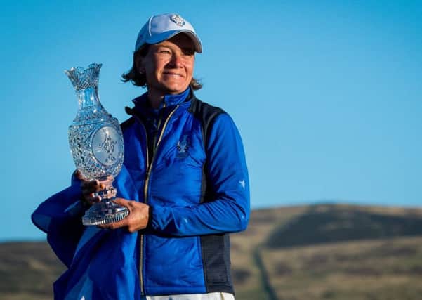 Solheim Cup-winning captain Catriona Matthew poses with the trophy after inspiring her team to their 14½-13½ victory over the USA. Picture: SNS.