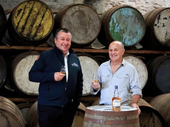 Pulteney Distillery manager Malcom Waring (left) with cameraman Doug Allan. Picture: Roddy MacKay