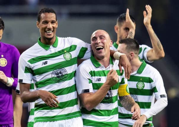 Celtic pair Scott Brown and Christopher Jullien celebrate the Europa League play-off win against AIK. Picture: Craig Williamson/SNS