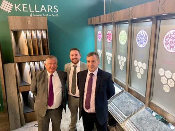 Bobby Gilhooly (centre) with Scotland area sales managers Dave Wood (left) and Charlie Anderson (right) on the Kellars stand at the recent UK flooring exhibition. Picture: Contributed