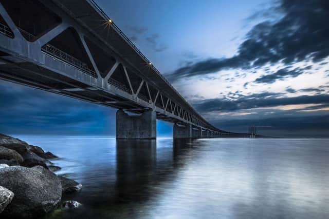 Oresund Bridge, Oresundsbroen, world's longest cable-stayed bridge connecting Copenhagen with Malmo. Photo by Daniel Kreher/imageBROKER/Shutterstock
