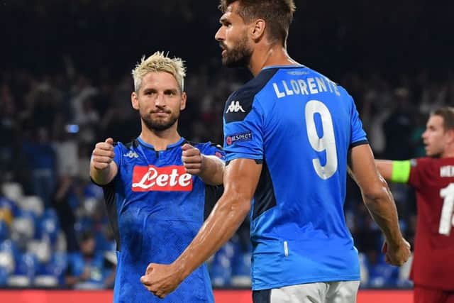 Dries Mertens and fellow scorer Fernando Llorente celebrate Napolis second goal in injury time. Picture Andreas Solaro/AfP/Getty