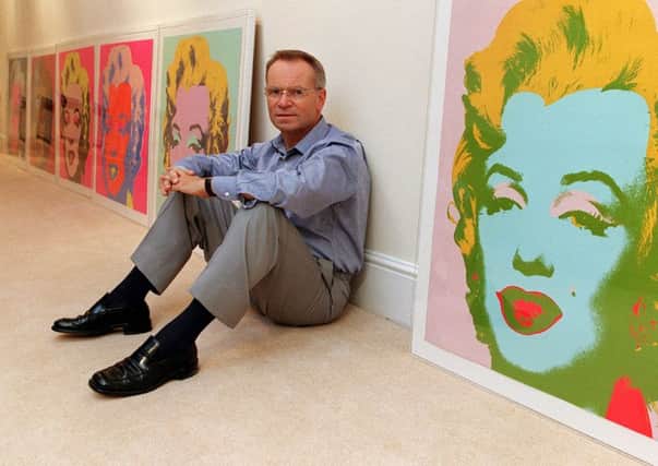 Art lover and author Jeffrey Archer with a host of Andy Warhols. Picture: Peter Jordan/PA