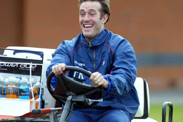 Fernando Ricksen goes for a spin at training in March 2003