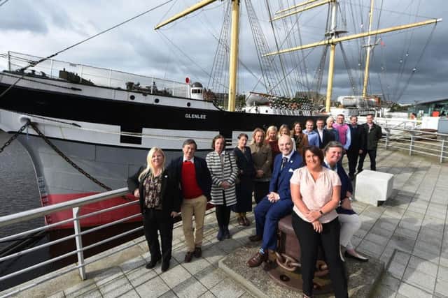 VisitScotland regional quality tourism manager Anne Massey (centre of the mooring) with West Coast Waters co-ordinator and campaign project manager Carron Tobin (to her left) and Stuart Wilson of CalMac (to her right). Picture: VisitScotland/Ian Watson.