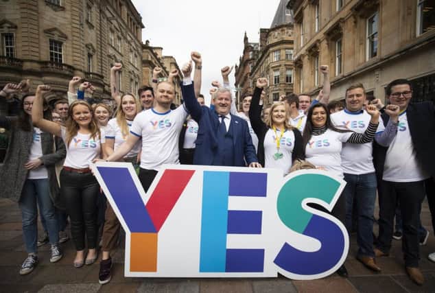 SNP Westminster leader Ian Blackford MP joins young campaigners in Glasgow city centre to mark five years since the Scottish independence referendum. Picture: PA