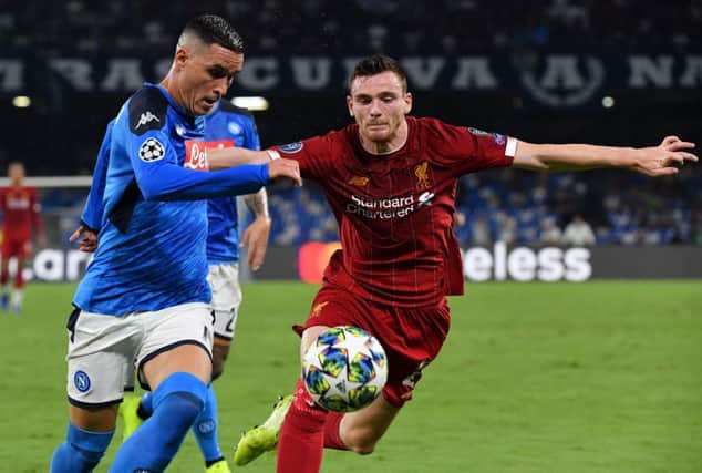 Andy Robertson tangles with Napoli forward Jose Callejon during the Champions League clash in Naples. Picture: AFP/Getty Images