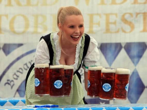 Traditional German dress and beer by arm-load is in order at Oktoberfest. Picture: Edinburgh Oktoberfest.