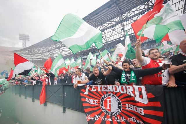 Feyenoord fans with a banner reading 'You'll Never Walk Alone'