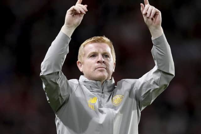 Neil Lennon greets the Celtic supporters after the draw with Rennes. Picture: David Vincent/AP