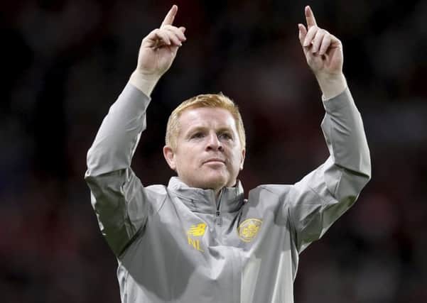 Neil Lennon greets the Celtic supporters after the draw with Rennes. Picture: David Vincent/AP
