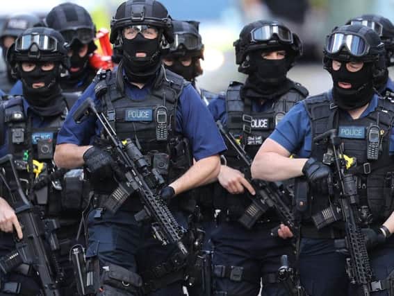 Concerns about young Scots becoming involved in extremism are increasing. These counter terrorism officers were called to the scene of the London Bridge terror attack in 2017. Dan Kitwood / Getty Images