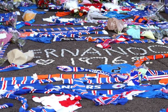 Floral tributes outside the stadium for former Rangers player Fernando Ricksen. Picture: Andrew Milligan/PA Wire