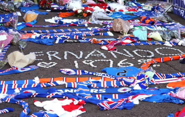 Floral tributes outside the stadium for former Rangers player Fernando Ricksen. Picture: Andrew Milligan/PA Wire