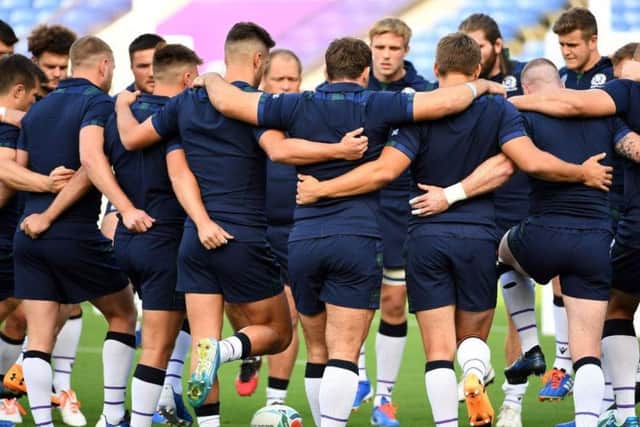 The Scotland players huddle during a training session ahead of their World Cup opener against Ireland