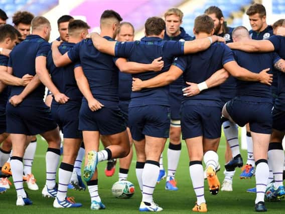 The Scotland players huddle during a training session ahead of their World Cup opener against Ireland