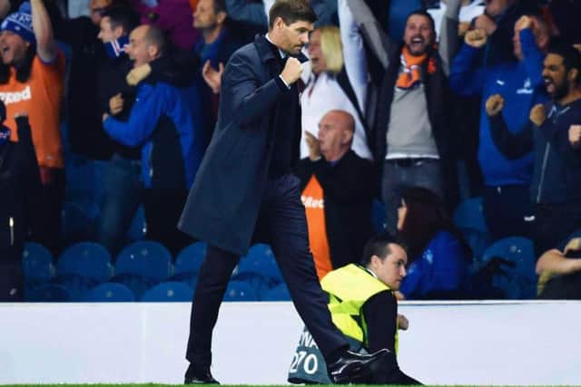 Steven Gerrard bathes in the Ibrox atmosphere. Picture: SNS