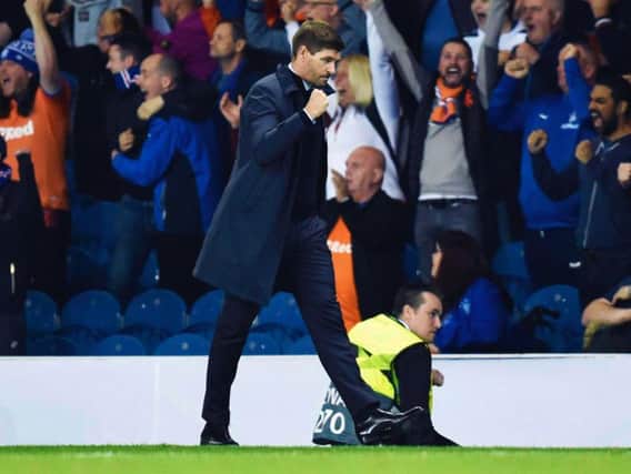 Steven Gerrard bathes in the Ibrox atmosphere. Picture: SNS